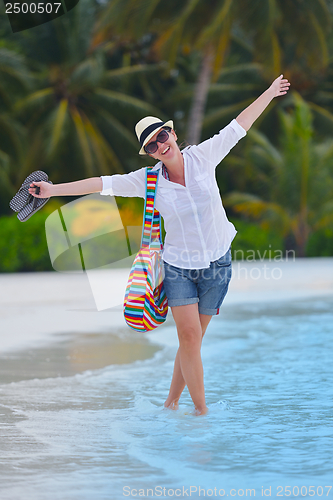 Image of beautiful gril on beach have fun