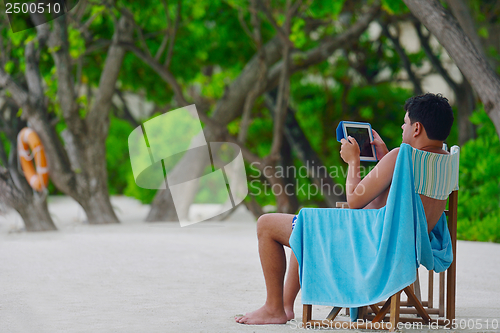 Image of beautiful gril on beach have fun