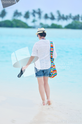 Image of beautiful gril on beach have fun