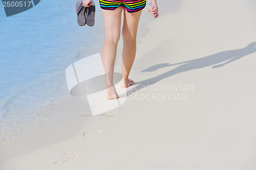 Image of beautiful gril on beach have fun