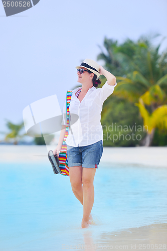 Image of beautiful gril on beach have fun