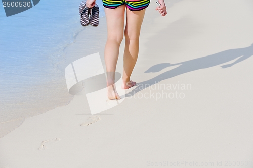 Image of beautiful gril on beach have fun