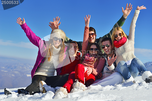 Image of friends have fun at winter on fresh snow