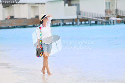 Image of beautiful gril on beach have fun