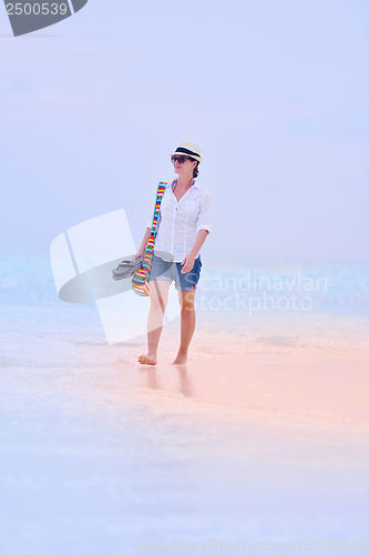 Image of beautiful gril on beach have fun