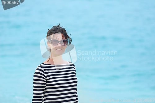 Image of beautiful gril on beach have fun