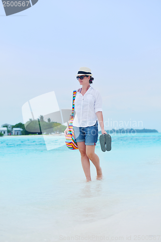 Image of beautiful gril on beach have fun