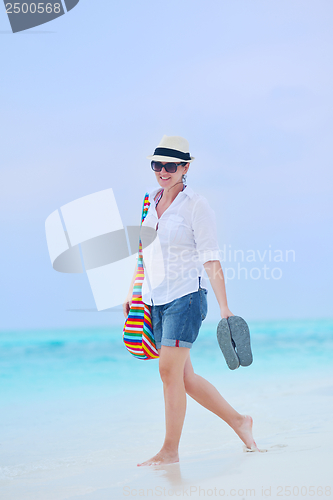 Image of beautiful gril on beach have fun