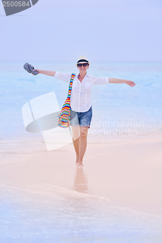 Image of beautiful gril on beach have fun