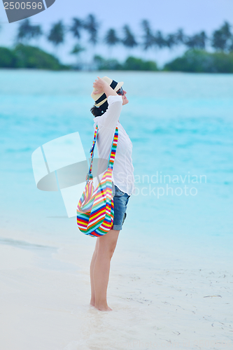 Image of beautiful gril on beach have fun