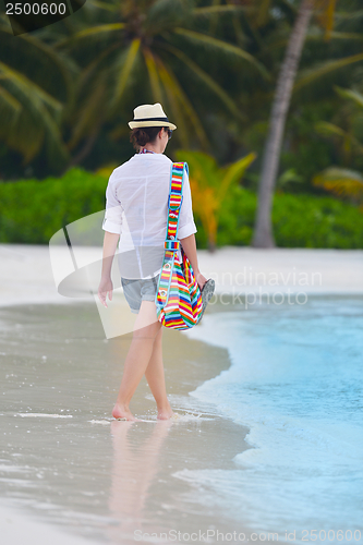 Image of beautiful gril on beach have fun