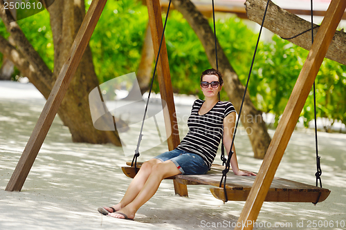 Image of beautiful gril on beach have fun