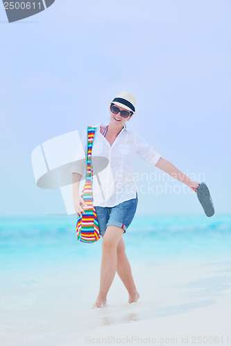 Image of beautiful gril on beach have fun