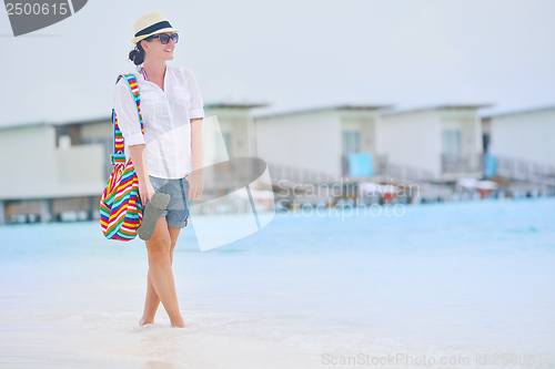 Image of beautiful gril on beach have fun