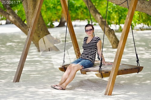 Image of beautiful gril on beach have fun