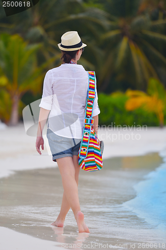 Image of beautiful gril on beach have fun