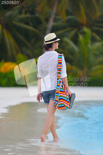 Image of beautiful gril on beach have fun