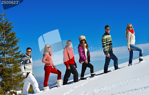 Image of friends have fun at winter on fresh snow