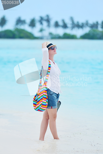 Image of beautiful gril on beach have fun