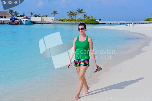Image of beautiful gril on beach have fun