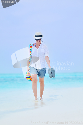 Image of beautiful gril on beach have fun