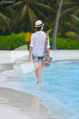 Image of beautiful gril on beach have fun