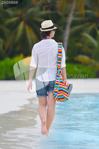 Image of beautiful gril on beach have fun