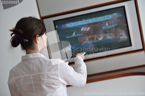 Image of happy young woman relax at home on sofa
