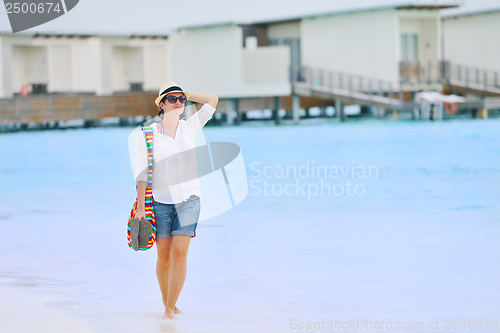 Image of beautiful gril on beach have fun