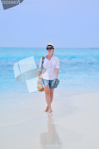 Image of beautiful gril on beach have fun