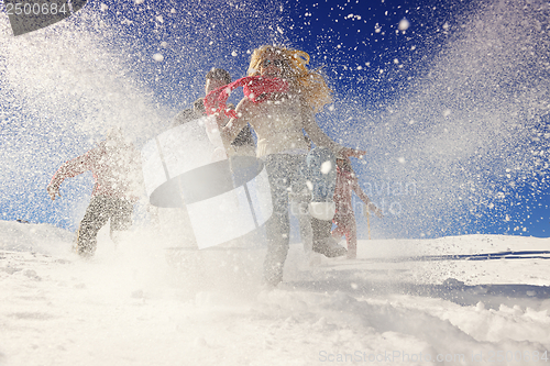 Image of friends have fun at winter on fresh snow