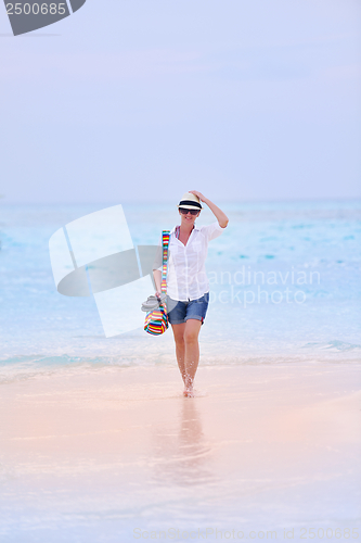 Image of beautiful gril on beach have fun