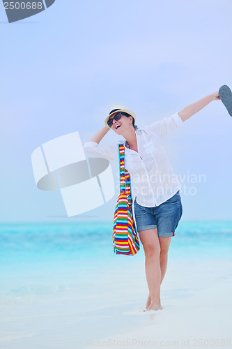 Image of beautiful gril on beach have fun