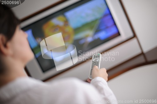 Image of happy young woman relax at home on sofa