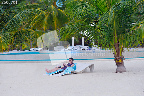 Image of beautiful gril on beach have fun