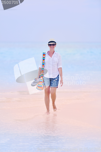 Image of beautiful gril on beach have fun