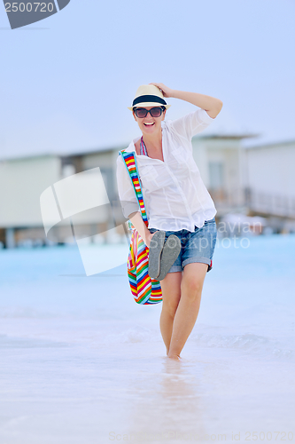 Image of beautiful gril on beach have fun