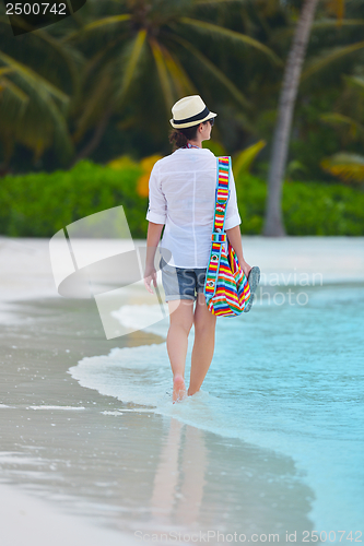 Image of beautiful gril on beach have fun