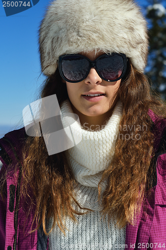 Image of family having fun on fresh snow at winter vacation