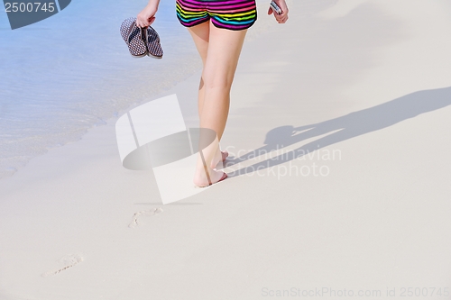 Image of beautiful gril on beach have fun