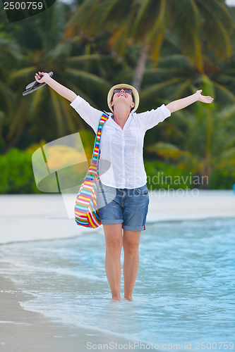 Image of beautiful gril on beach have fun