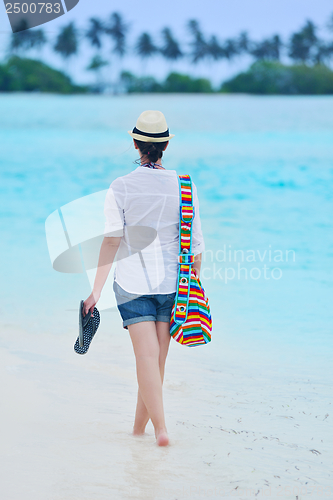 Image of beautiful gril on beach have fun