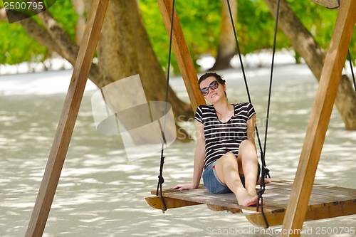 Image of beautiful gril on beach have fun