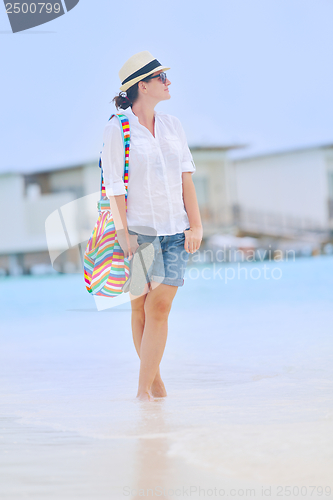 Image of beautiful gril on beach have fun