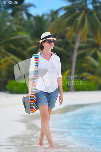 Image of beautiful gril on beach have fun