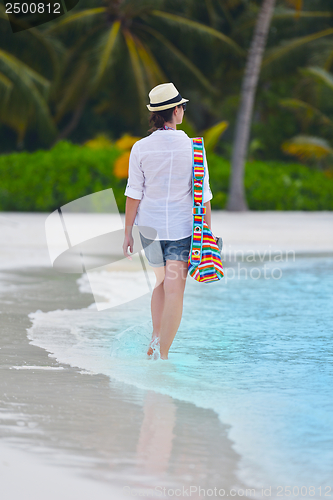 Image of beautiful gril on beach have fun