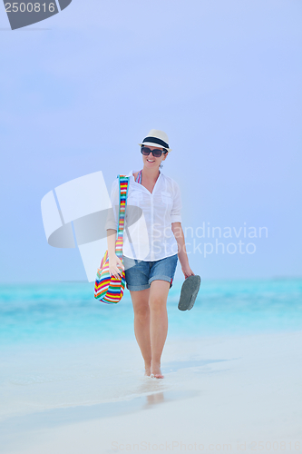 Image of beautiful gril on beach have fun