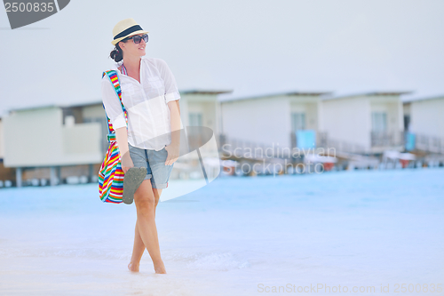 Image of beautiful gril on beach have fun