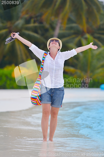 Image of beautiful gril on beach have fun
