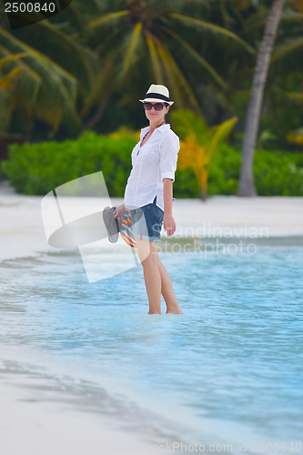 Image of beautiful gril on beach have fun